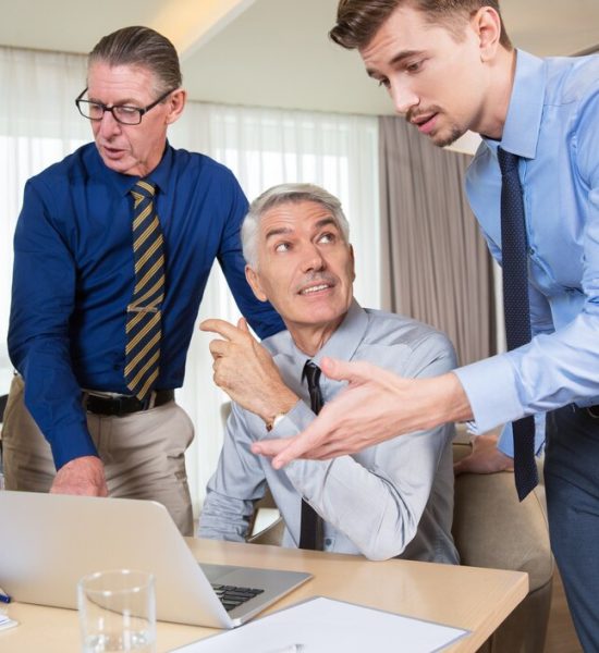 Three professionals discussing investment strategies for all life stages.