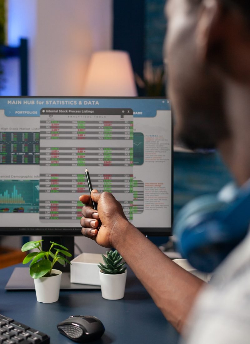 Young business man analyzing stock market value