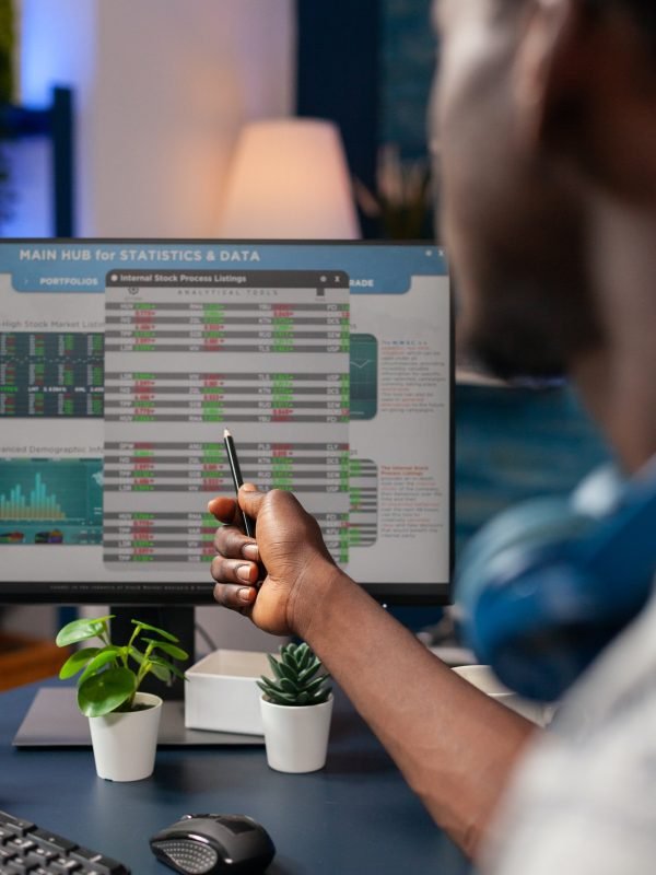 Young business man analyzing stock market value