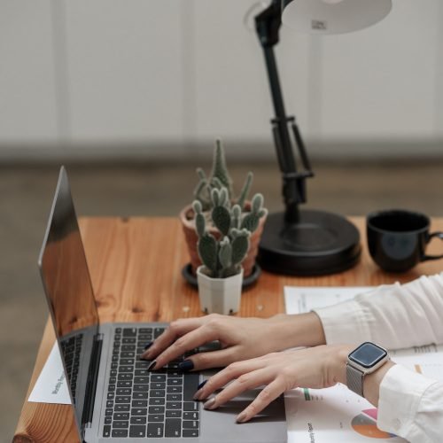 Business woman hand using laptop with bank savings account application, account or saving money or