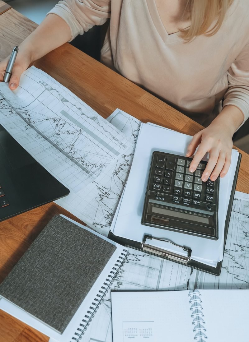 Investments. Young woman investor buys stocks on the stock exchange stock market