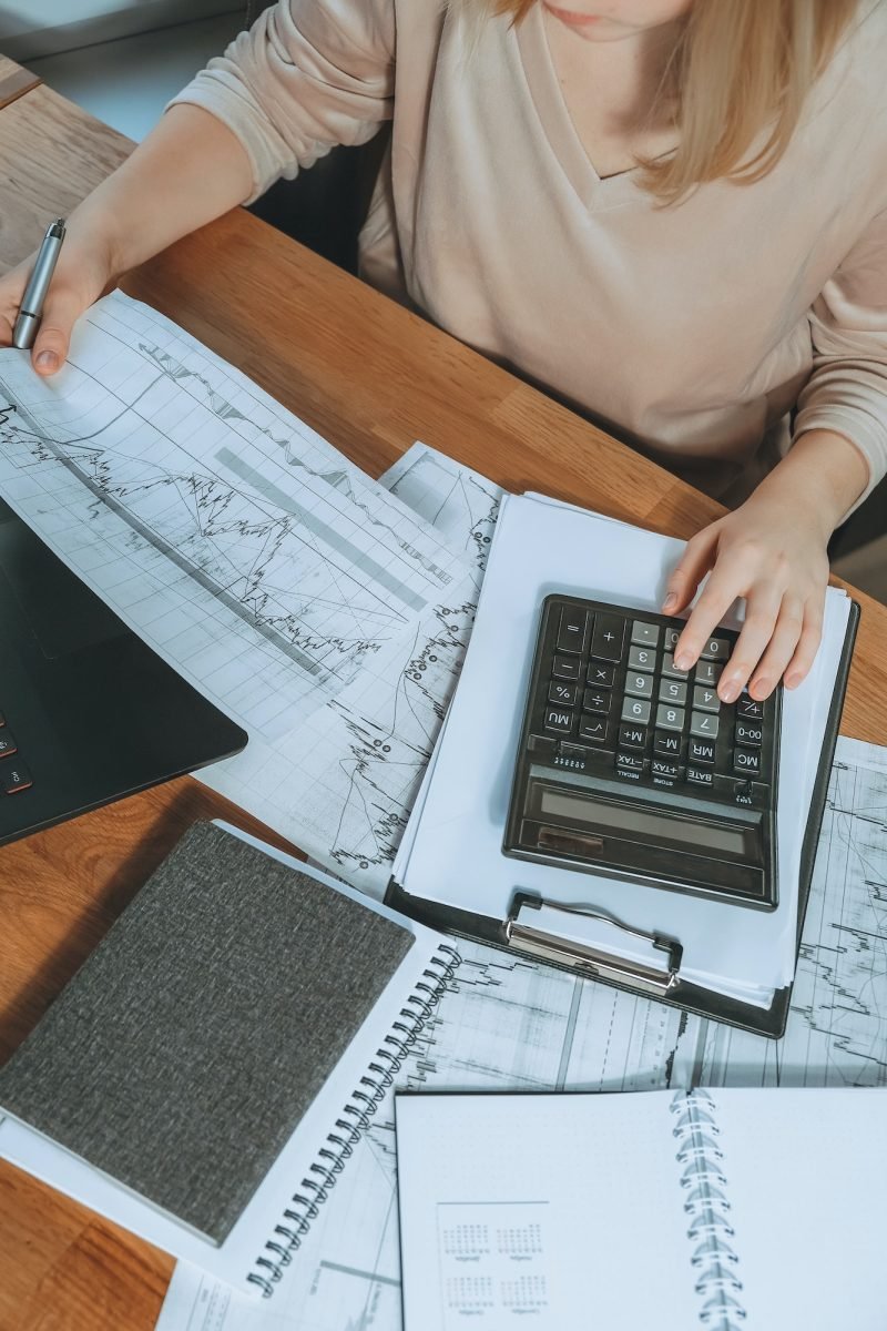 Investments. Young woman investor buys stocks on the stock exchange stock market