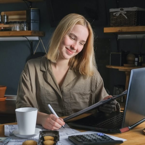 Investments. Young woman investor buys stocks on the stock exchange stock market from home