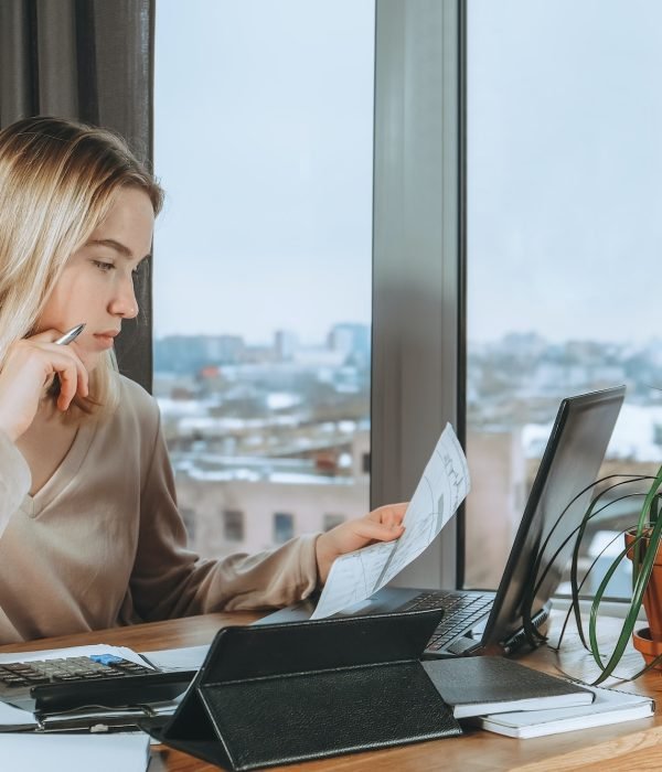 Investments. Young woman investor buys stocks on the stock exchange stock market