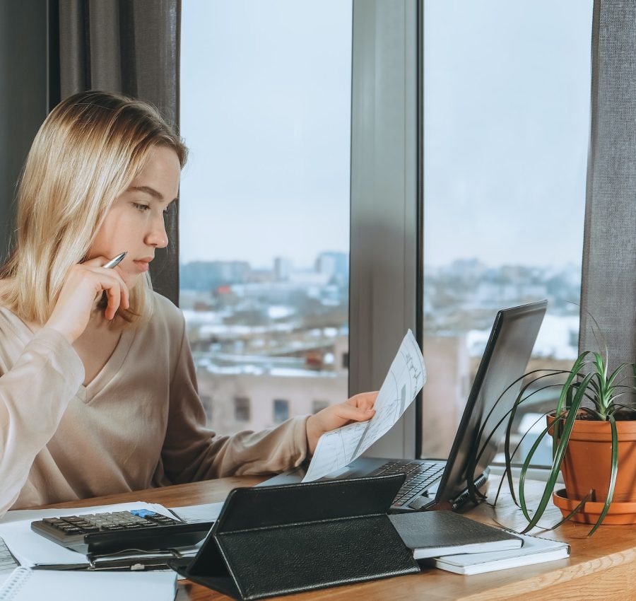 Investments. Young woman investor buys stocks on the stock exchange stock market