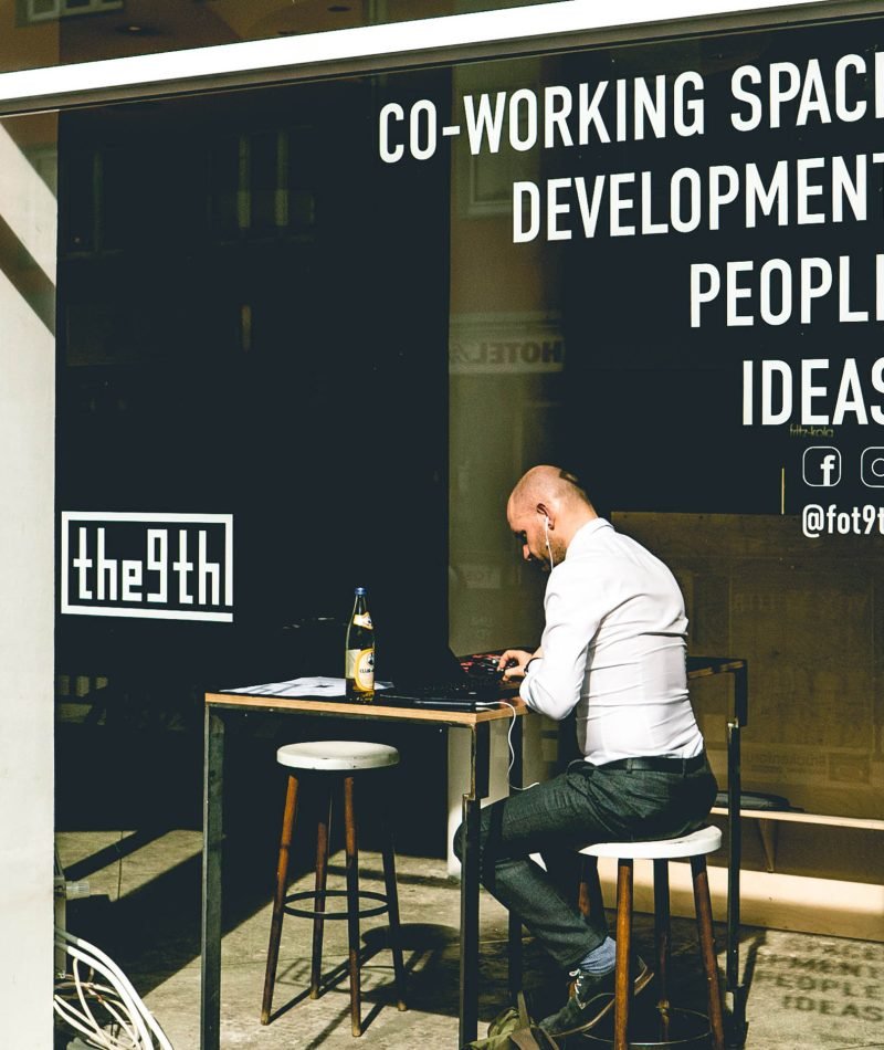 Man sitting on a chair with a table in front
