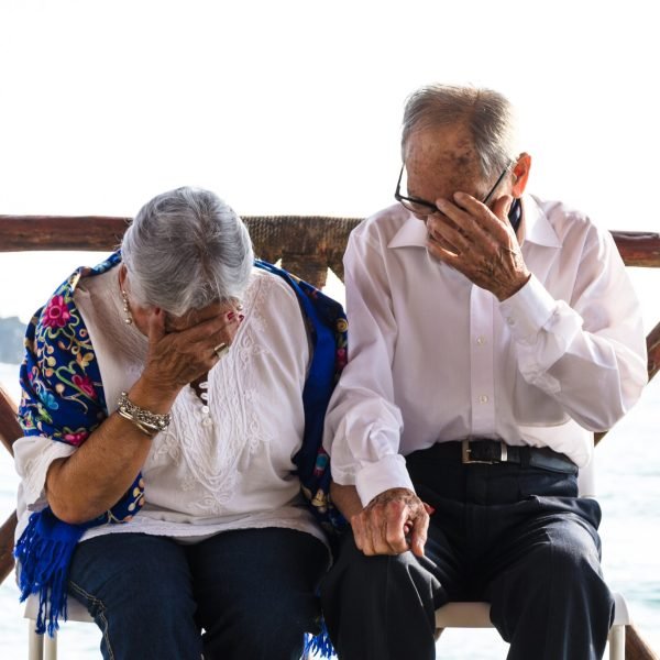 Elderly couple looking at each other laughing. Senior Citizens