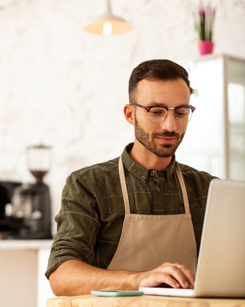 Owner of coffee shop developing business strategy