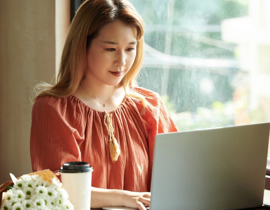 Young Woman Working on Laptop