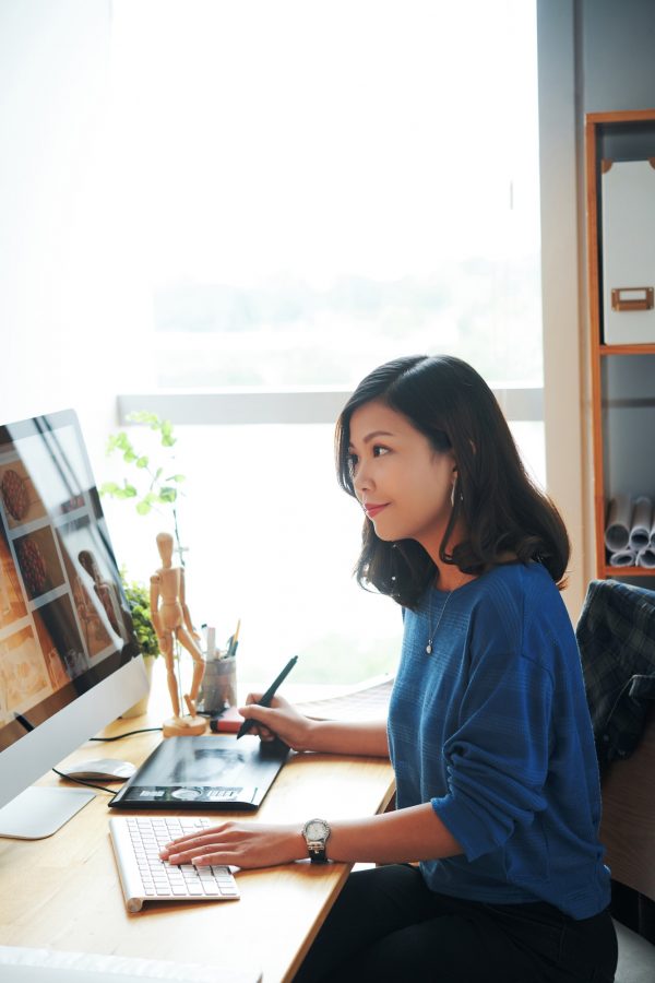 Young Woman Working With Stock Photos